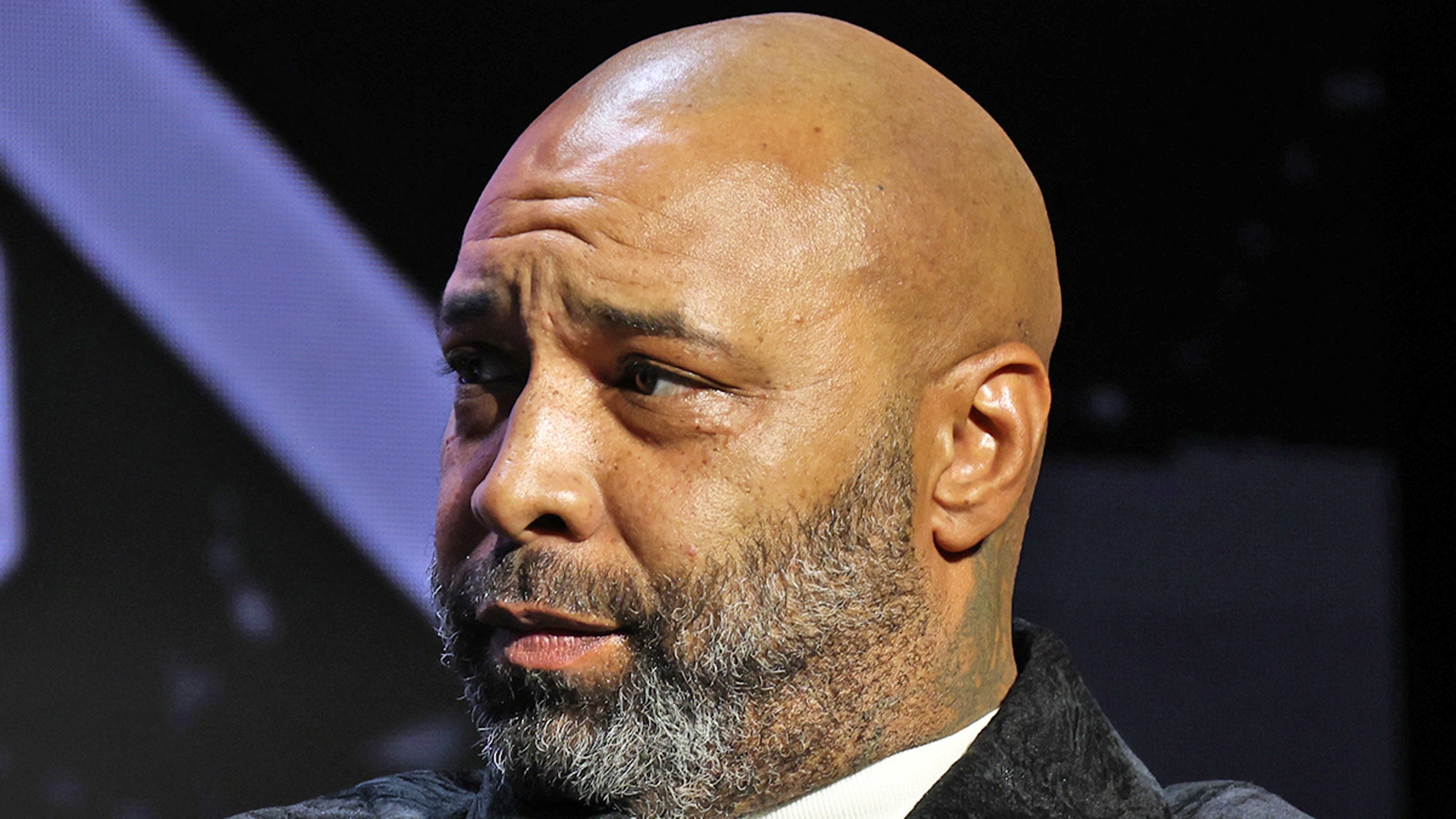 Joe Budden is charged for allegedly standing naked in the hallway