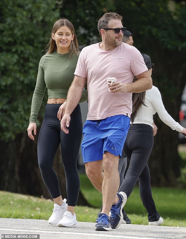 Football great Campbell Brown is seen with a mystery woman after being linked to an affair with the cricket legend's daughter when he split from his wife.