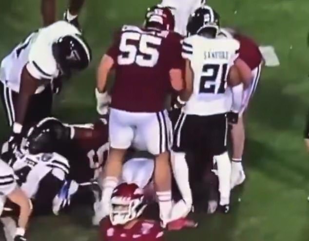 Former NFL player reacts to sickening stomp on Fernando Carmona's ankle as fans demand Razorbacks lineman be suspended