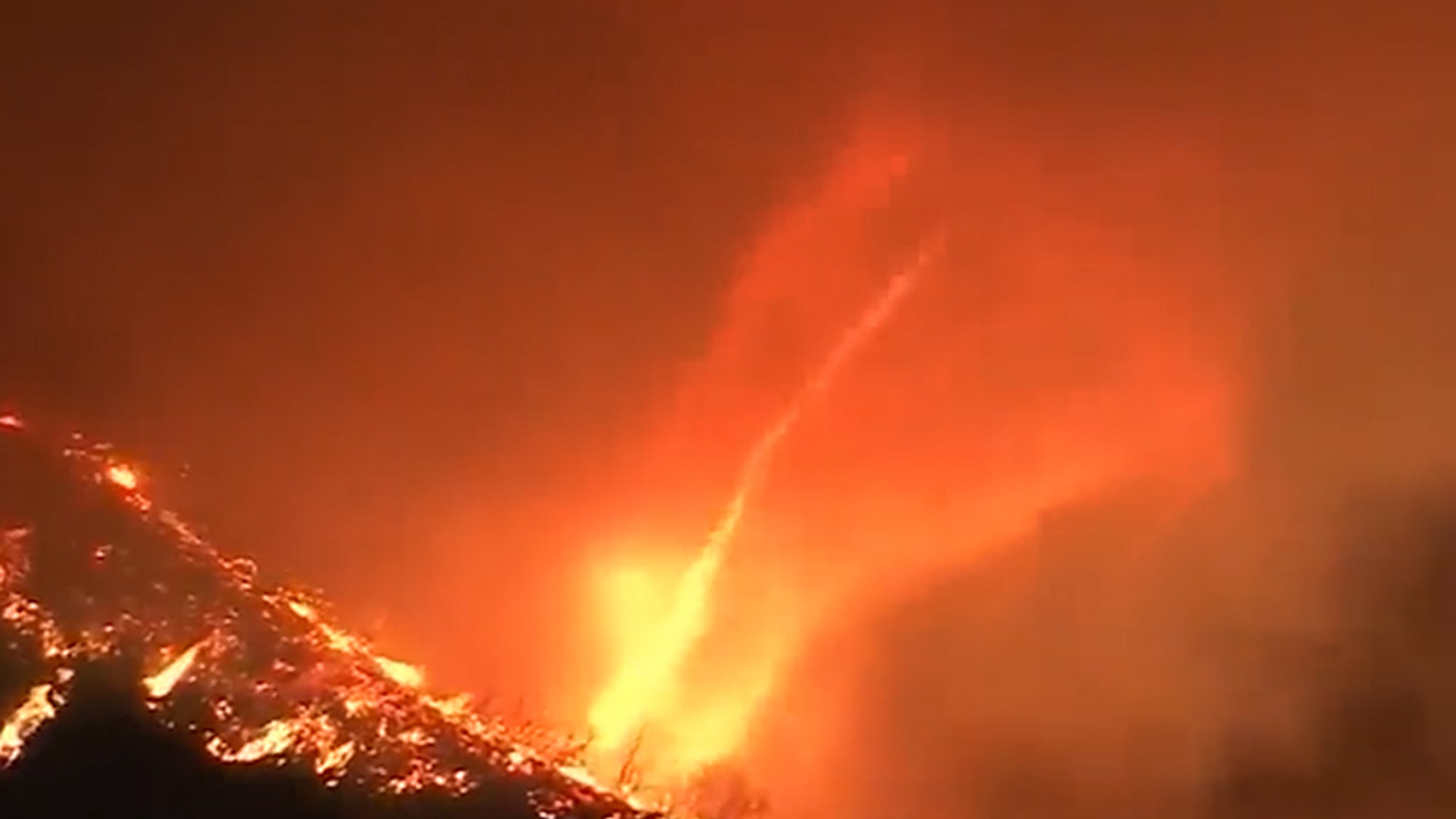 A fire tornado appears in the midst of a massive inferno that devastates Los Angeles