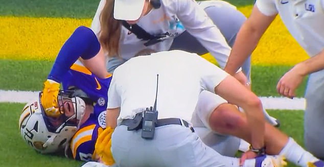 A gruesome video shows doctors putting a college football star's ankle back into place after a sickening injury.