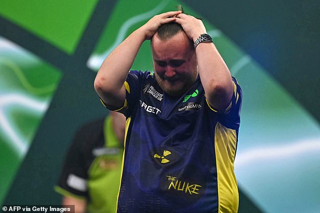 Luke Littler breaks down in tears after winning the World Darts Championship before the teen sensation, 17, shares a touching moment with Michael van Gerwen.