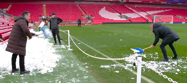 Gary Neville hilariously tries to cancel Man United's trip to Anfield by shoveling snow back onto the pitch amid fears of a rout at Liverpool.