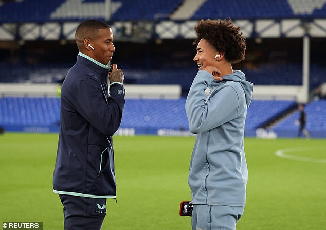 Ashley Young shares a touching moment with her 18-year-old son Tyler ahead of Everton's FA Cup clash against Peterborough, as they both start on the bench for the third round tie.