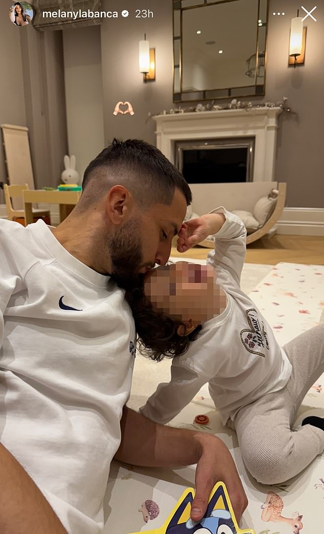 Rodrigo Bentancur pictured at home posing in a touching family photo two days after worrying collapse on the pitch during Tottenham's win over Liverpool.