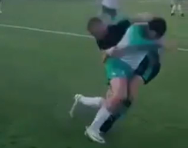 Moment Conor McGregor FIGHTS his opponent on the ground in an amateur football match, before following up with a forceful tackle!