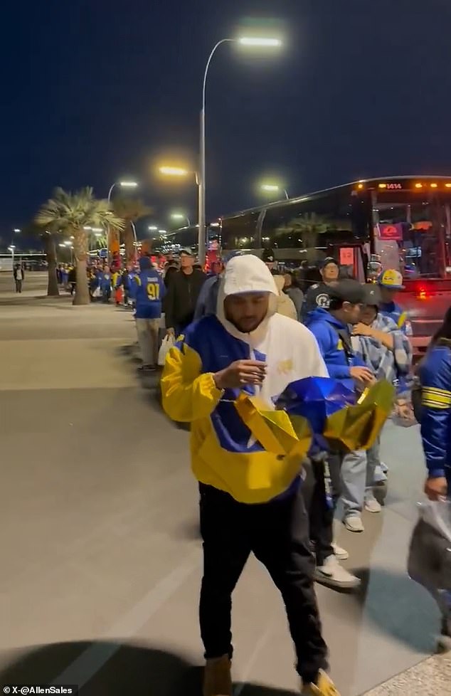 Thousands of LA Rams fans line up before dawn to take buses to Arizona after NFL playoff game relocated amid wildfires