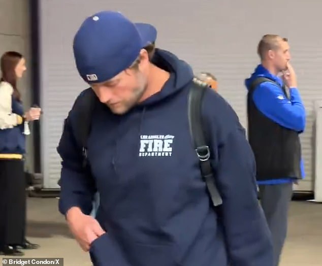 Rams quarterback Matthew Stafford pays tribute to Los Angeles firefighters before the playoff game against the Vikings.