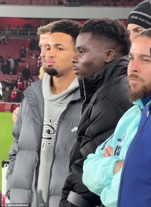 Bukayo Saka attends Arsenal's north London derby against Tottenham as he recovers from hamstring injury surgery and watches his teammates train on crutches alongside Ethan Nwaneri.