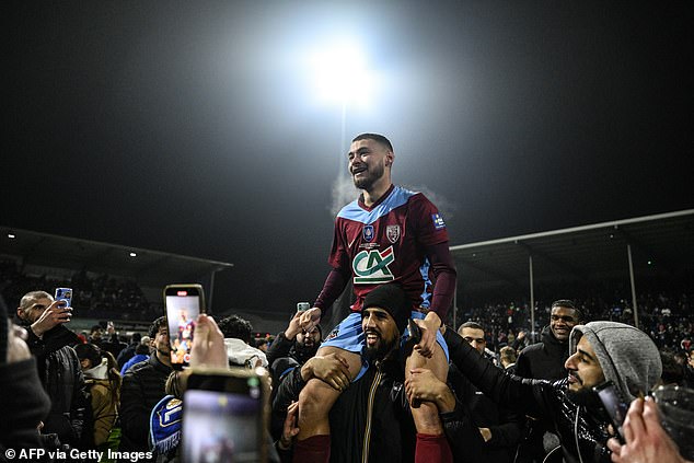 Lyon are stunned by amateur side FC Bourgoin-Jallieu in the Coupe de France, prompting an invasion of wild pitching from their delirious fans.