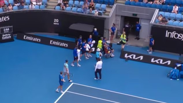 Australian Open ballboy collapses mid-match due to extreme heat, as play halts amid worrying scenes in Melbourne