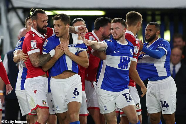 Wrexham vs Birmingham is celebrity-funded 'Hollywood derby' drawing fans in the US to 'immersive reality' venues; could be the most surreal League One match of all time, writes IAN HERBERT