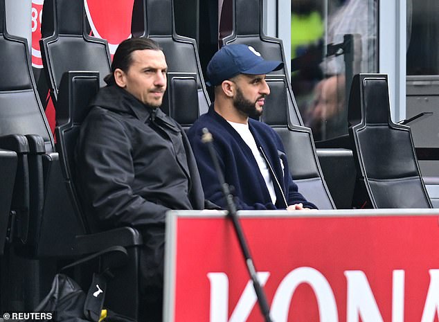 Kyle Walker observes his new AC Milan team in action along with Zlatan Ibrahimovic, after preventing Lauryn Goodman from moving to Italy