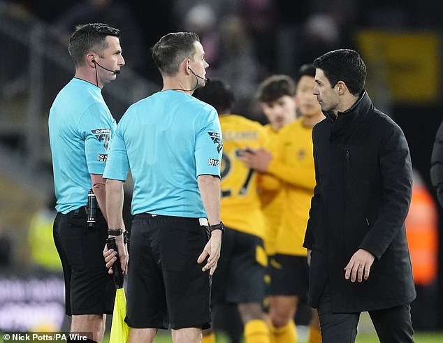 'Furious' Mikel Arteta shares tense verbal exchange with referee Michael Oliver after Myles Lewis-Skelly's controversial dismissal against Wolves.