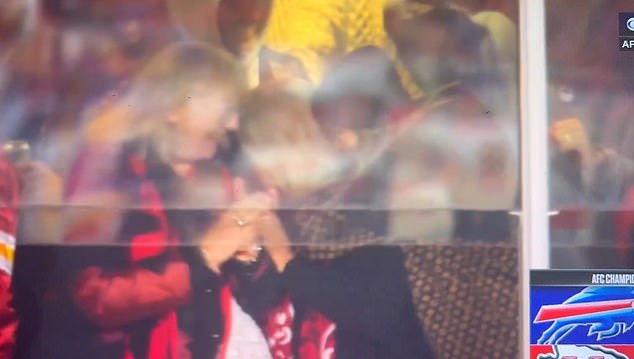 Taylor Swift gives her mom Andrea and Donna Kelce a big hug while celebrating the Chiefs' touchdown against the Bills.