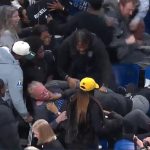 Wild Brawl explodes in the crowd in the university basketball game while irritating fans fall through seats