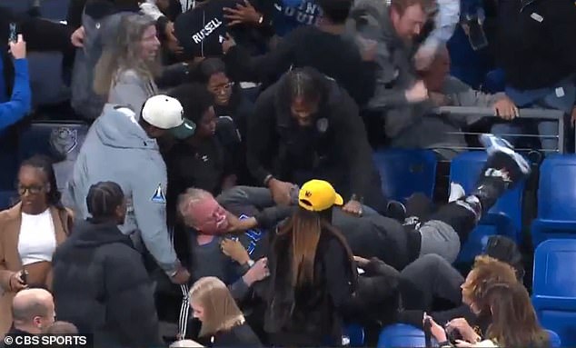 Wild Brawl explodes in the crowd in the university basketball game while irritating fans fall through seats