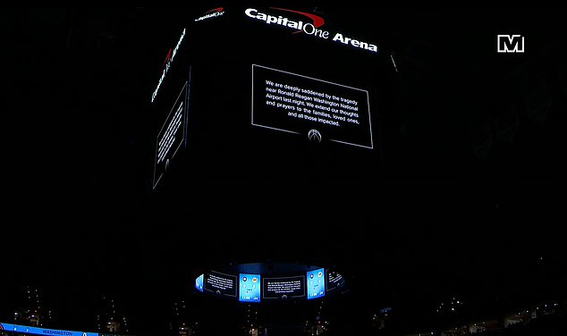 Washington Wizards pay tribute in motion to air accident victims before the NBA game against the Lakers