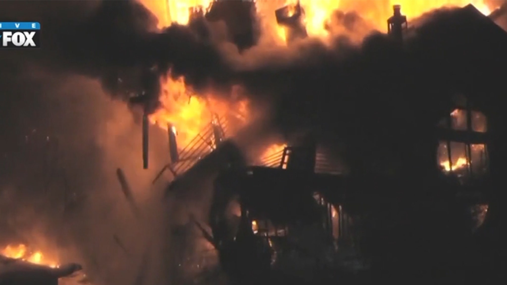 City House studio engulfed in flames collapses on live TV and video