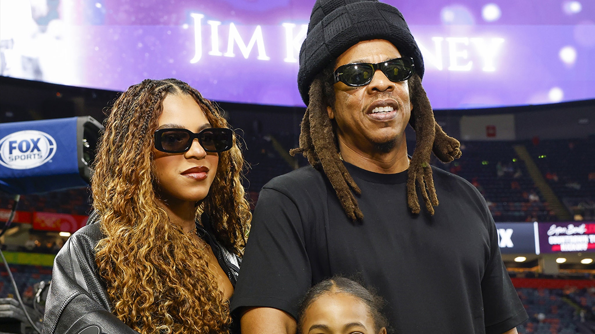 Jay-Z has fun with the daughters Blue Ivy and Rumi on the Super Bowl side lines