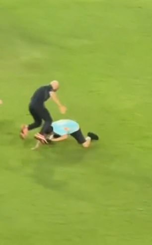 Lionel Messi's bodyguard is finally beaten after being attacked by a fan who invades the launch … with the follower managing to hug the Argentine icon before being escorted out of the countryside