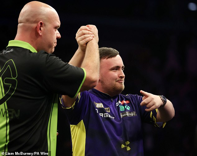 Fans detect Luke Littler's gesture to croorate Michael Van Gerwen after the Dutch rival criticized him as a 'baby' for sleeping before the photo shoot