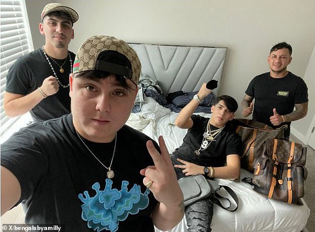 The new surprising image shows shameless illegal immigrants posing in Joe Burrow's jewels after assault