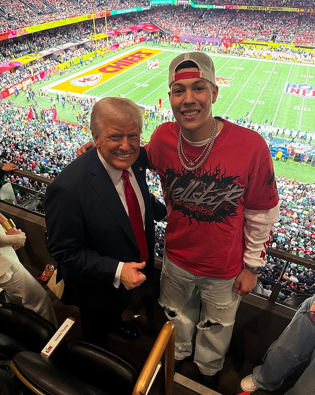 Donald Trump poses for a photo with Jackson Mahomes in the Super Bowl 2025