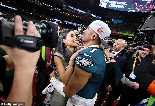 The new NFL power couple? Jalen Hurts shares a romantic moment with the promised Bry Burrows in the field