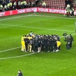 Leeds United's captain Ethan Ampadu, delivers a scream of rally to teammates inside Huddle after the final whistle of his return victory over Sheffield United