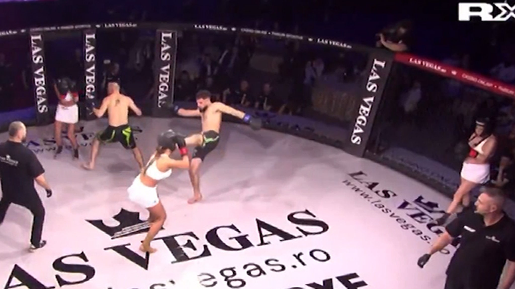 Two men pump three single fans models in annoying, sanctioned MMA fight