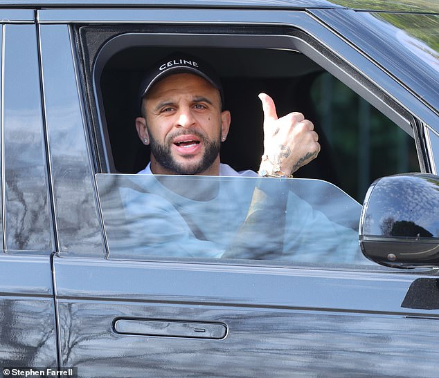 Kyle Walker looks surprisingly in a good mood while heading home Annie Kilner after she stayed “far from happy” when he went partying with Serbian models in Milan