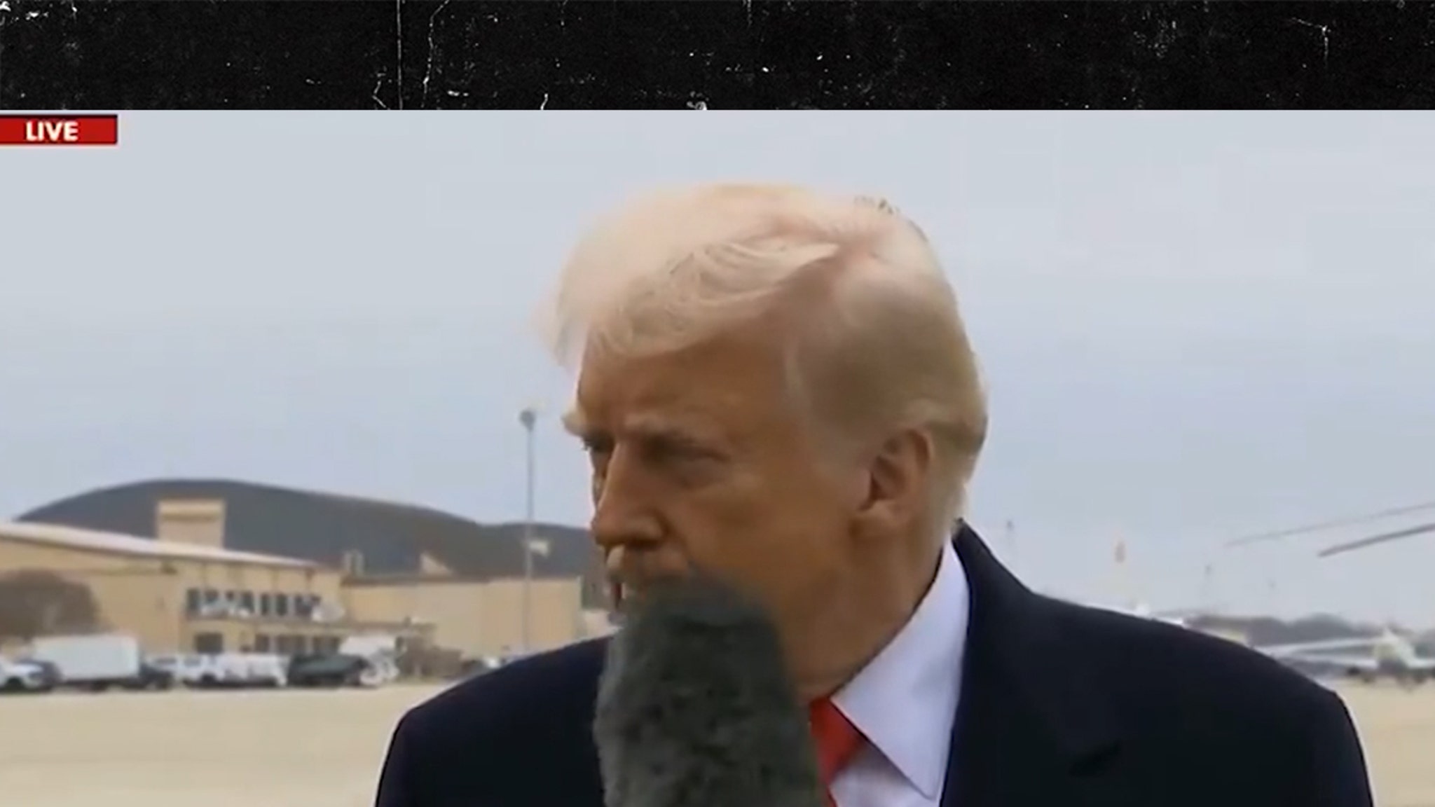 President Trump hit the reporter's microphone in the face